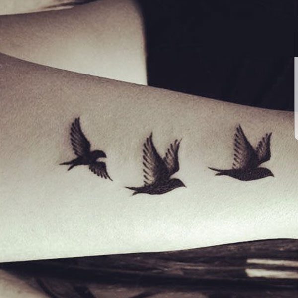 Small black bird  shading tattoo on wrist