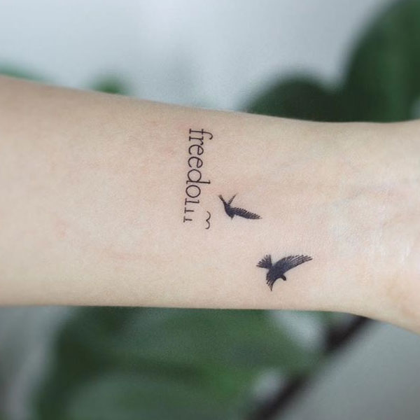 Birds freedom, a small meaningful tattoo on hand