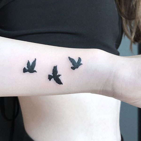 Small Black Birds tattoo wrist