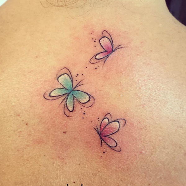 Cute tiny colorful butterfly tattoo