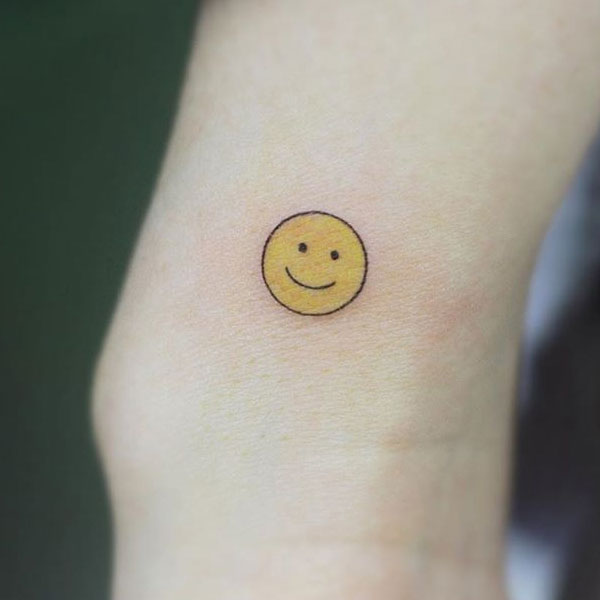  Cute simple yellow small smile tattoo