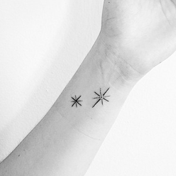 Minimal shining star tattoo