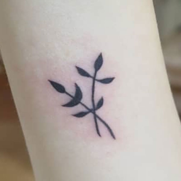 Small black leaves tattoo for hand