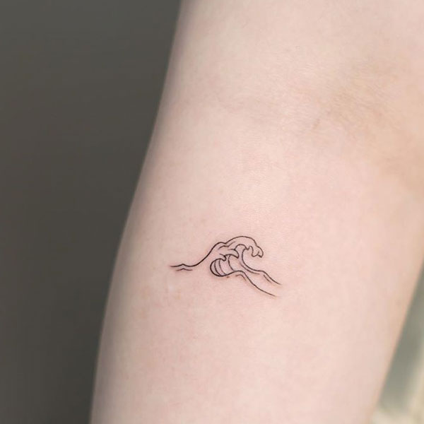 Tiny minimal ocean wave tattoo