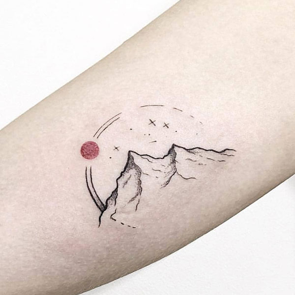 Small creative mountain tattoo for mountain lovers