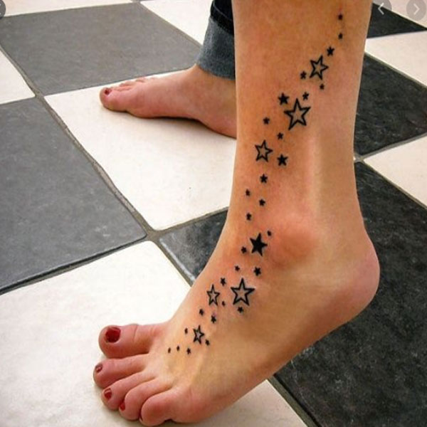  Small shooting stars tattoo on ankle 