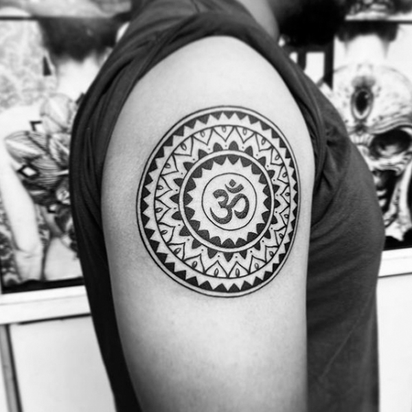 Awesome mandala om tattoo design on the bicep