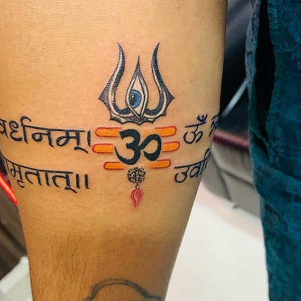 Amazing Om and creative trishul tattoo design