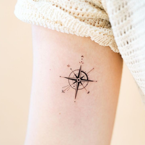 Black compass minimal tattoo design