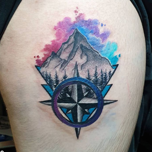 Colorful creative compass and mountain tattoo 