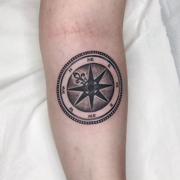 Traditional compass dot work tattoo