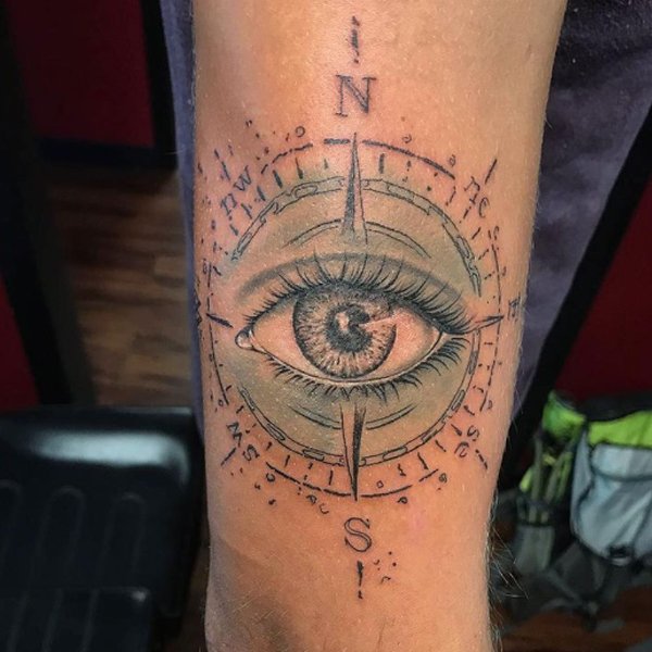 Creative compass and eye tattoo design