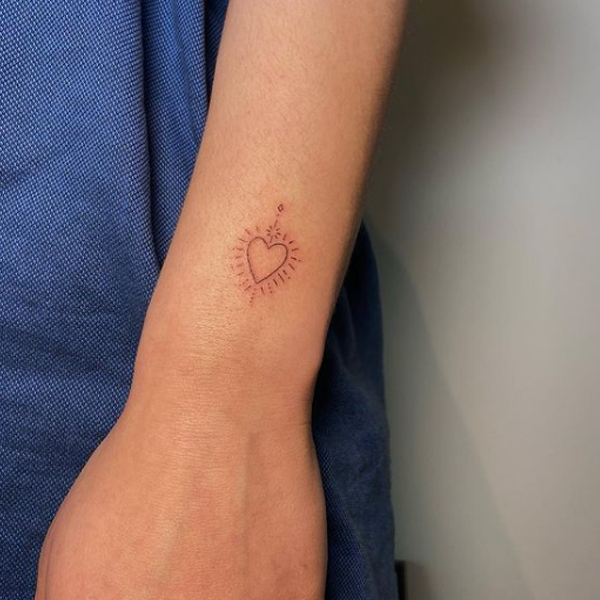  Simple tiny shining heart design tattoo