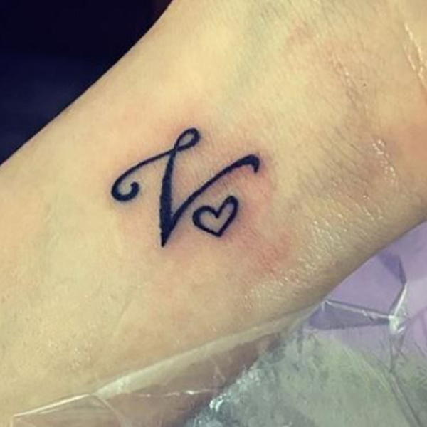 Elegant v-alphabet and small heart tattoo design