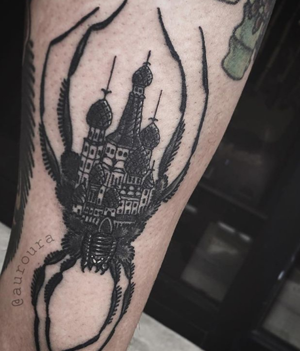 Black spooky spider building tattoo