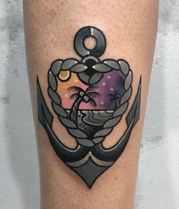 Dashing black and grey anchor with beach site tattoo