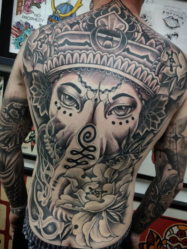 Awesome Lord Ganesh Tattoo design over the back