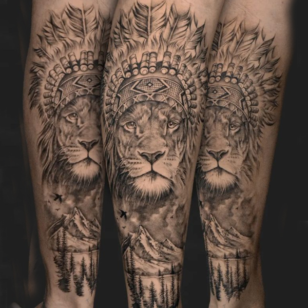 Gorgeous traditional lion and mountain tattoo