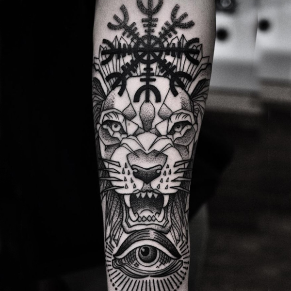 The helm, lion, and eye of god tattoo