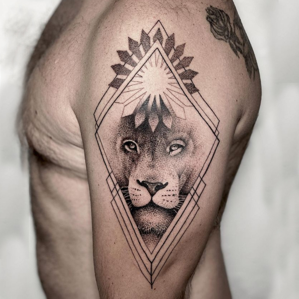 Gracious lion dot work sun tattoo