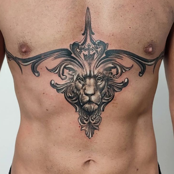 Dazzling lion metallic chest tattoo