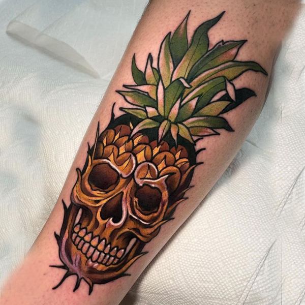 A creative pineapple skull tattoo design