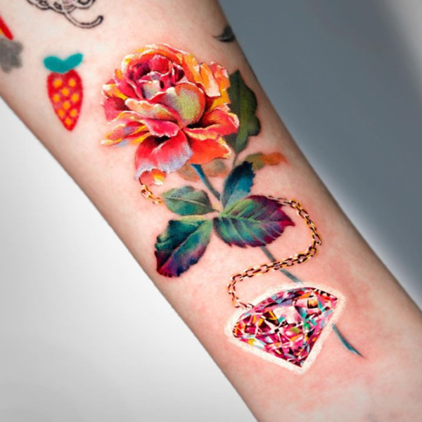 Splendid Realism rose flower and jewelry tattoo design